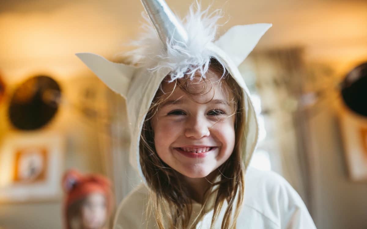little girl with bunny costume with healthy Halloween recipes and tips