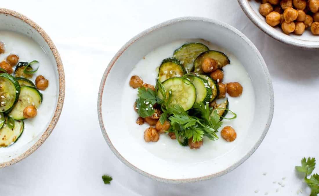 savory yogurt bowls with greek yogurt, parsley, zucchini, and roasted legumes (chickpeas)