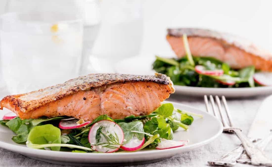 Pan-Seared Salmon on Arugula Salad with Tahini-Citrus Dressing