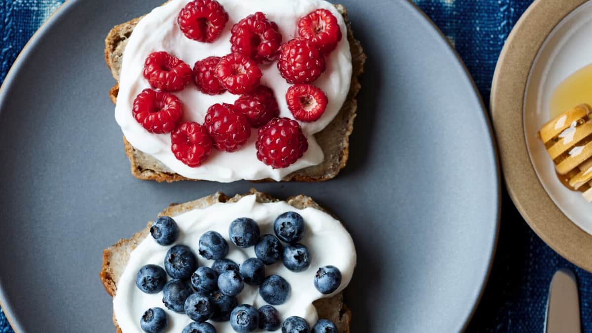 healthy toast topped with yogurt and berries
