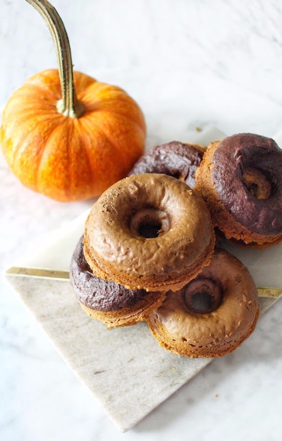 Pile of Gluten Free Baked Pumpkin Donuts Once Upon a Pumpkin with a small pumpkin