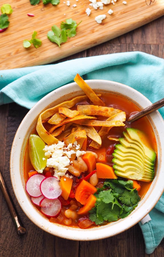 Butternut Squash Tortilla Soup with White Beans, seasonal produce, and avocado for warm fall meal