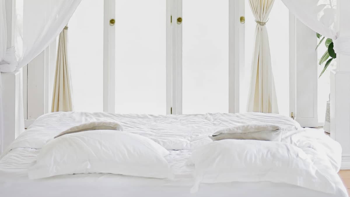 bed with white sheets