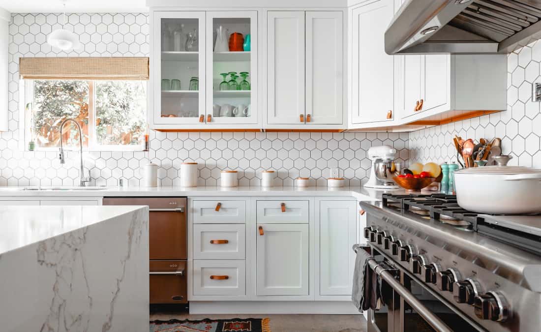 clean and organized kitchen with marble counter top