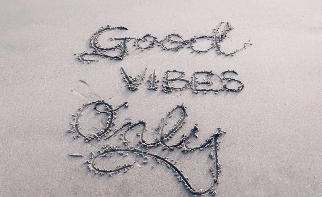 good vibes only written on sand for attitude of gratitude