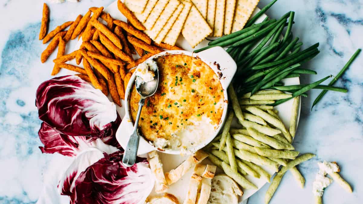 plant based appetizer with veggie crudites, crackers, and dip