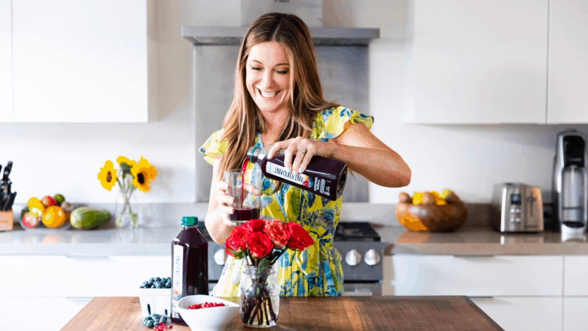 Patricia Bannan pouring Tropicana antioxidant drink