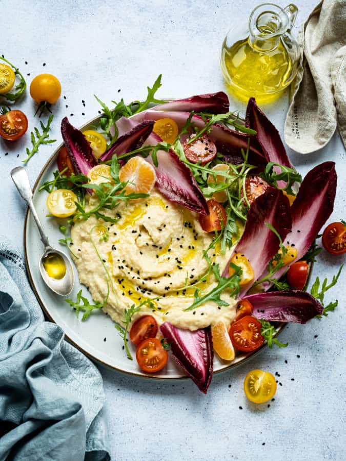 hummus platter with vegetables and olive oil