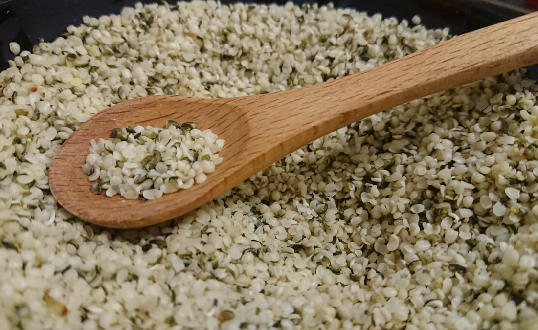 bowl of hemp seeds with spoon