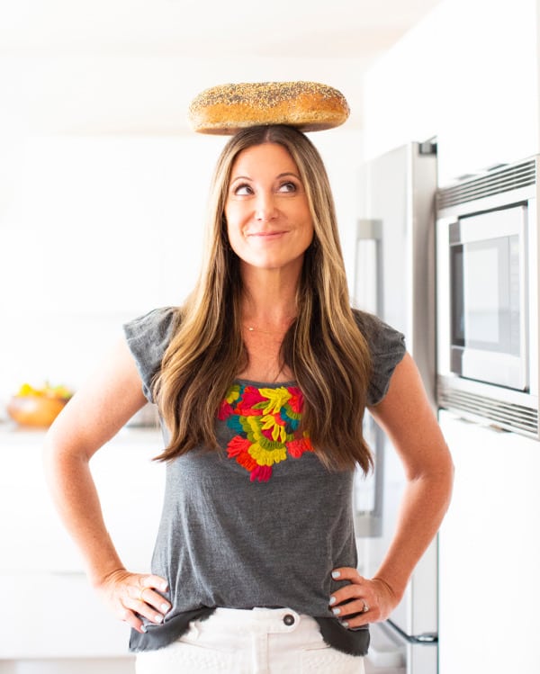 Patricia Bannan balancing bread in kitchen