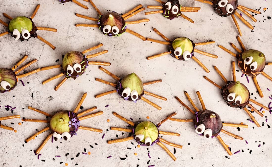 spider snacks with pretzels, chocolate, sprinkles, and marshmallows