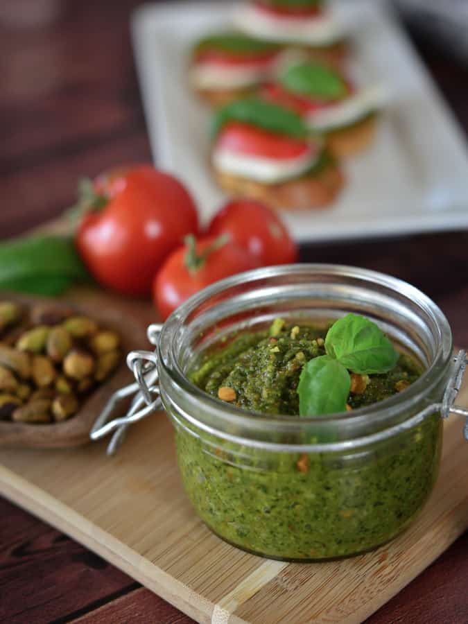 pistachio pesto in jar with tomato 