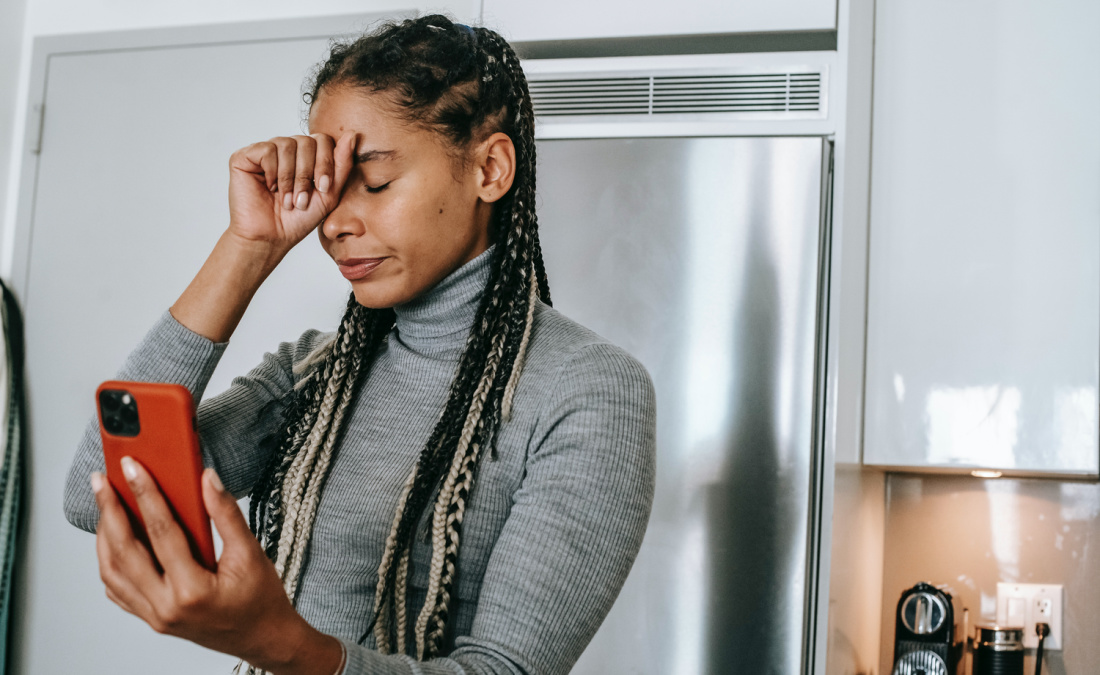 woman with brain fog in kitchen