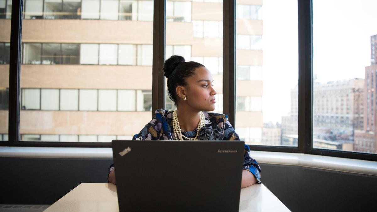 signs of burnout at work with woman looking out to distance