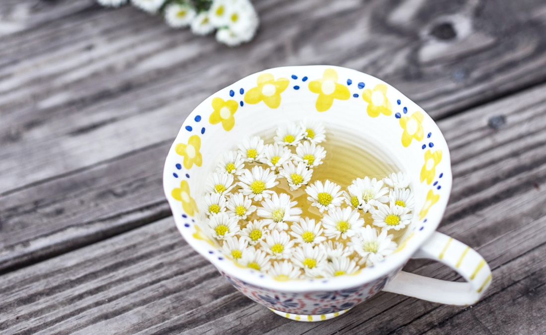 chamomile tea in floral tea cup
