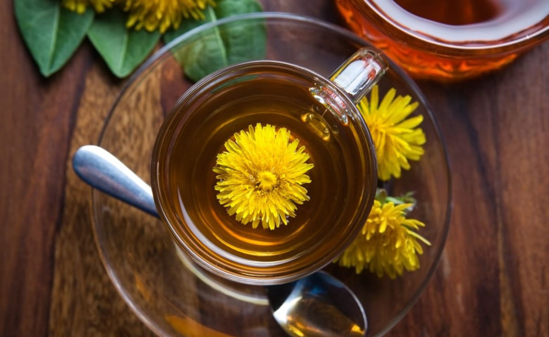 dandelion tea in a mug on wooden table