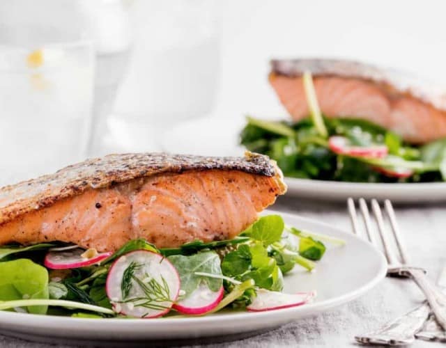 Pan-Seared Salmon on Arugula Salad with Tahini-Citrus Dressing